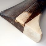 Fixation par adhésif et ponçage